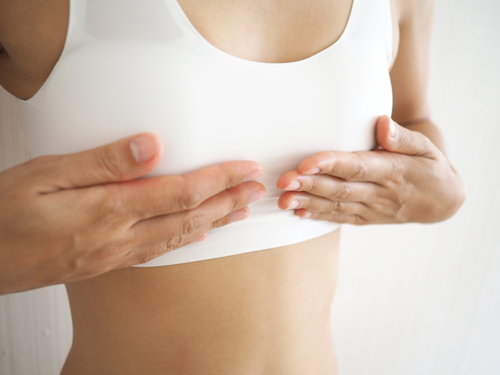 Patient wears a compression garment after transgender top surgery