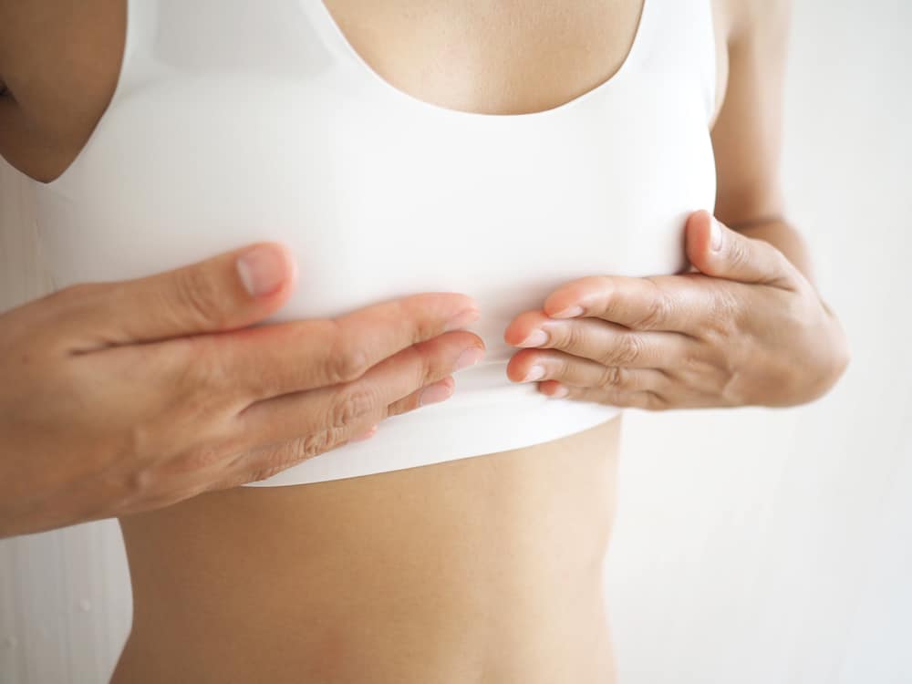 Patient wears a compression garment after transgender top surgery